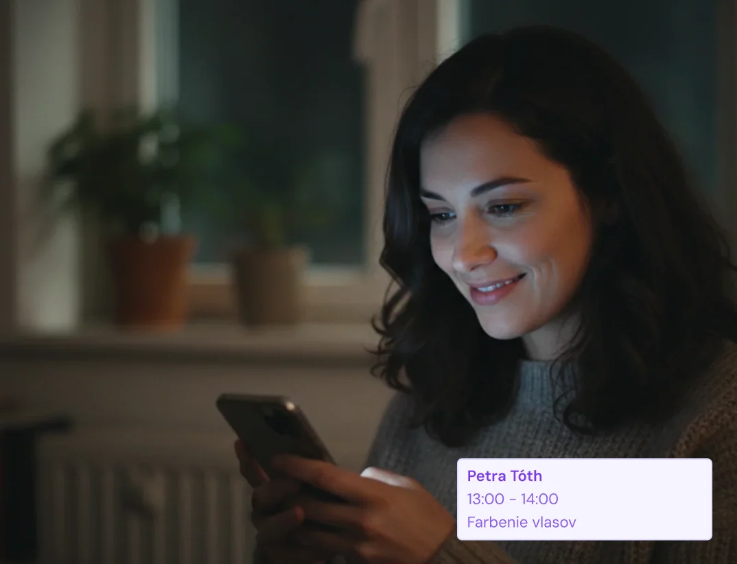 Client booking an appointment on a phone — online booking 24/7
